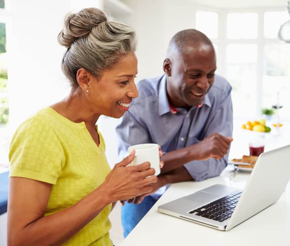 Older couple enjoying coffee together while exploring transitioning from independent living to assisted living in Houston, Texas